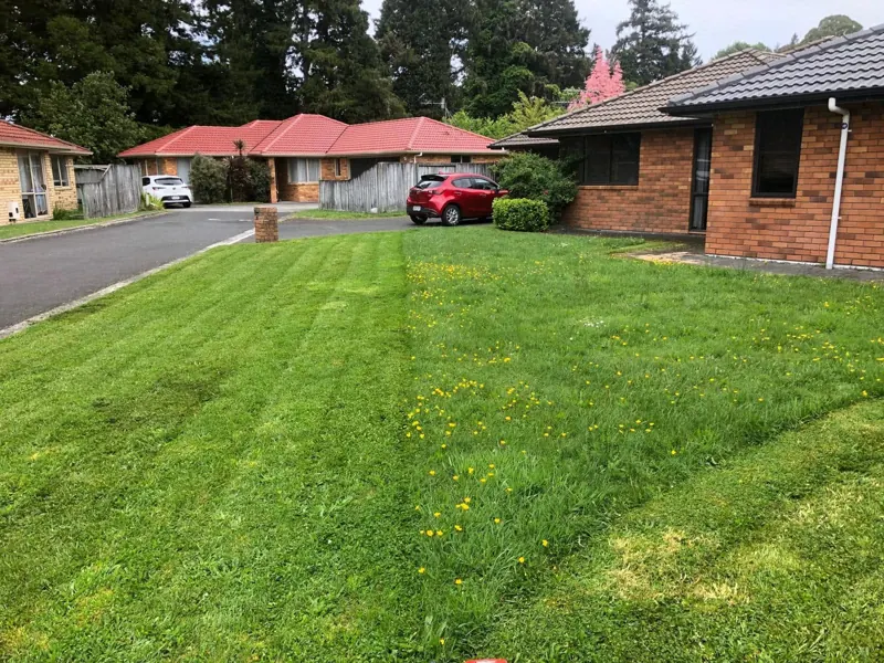 Brick unit with a freshly mown, striped front lawn
